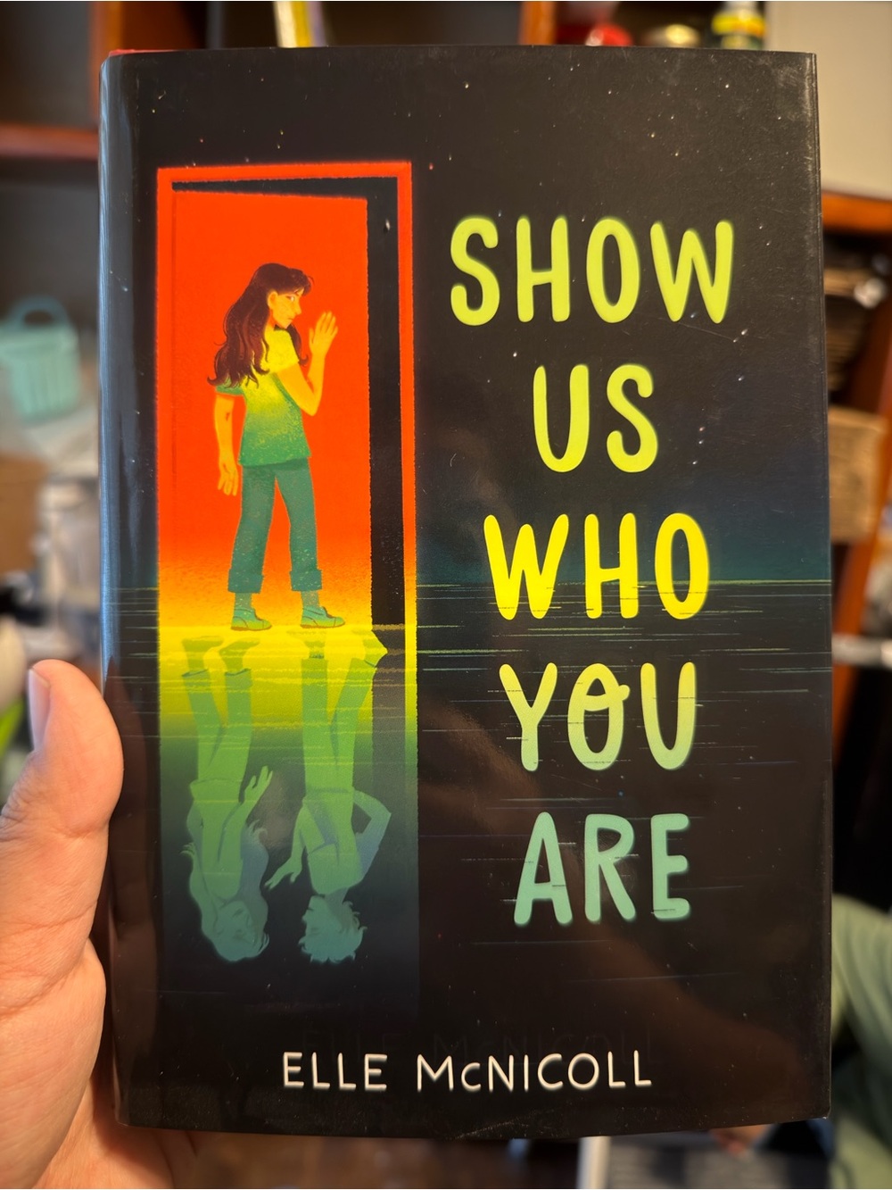 Show Us Who You Are by Elle McNicoll - Black Cover with Neon Yellow/Green Text